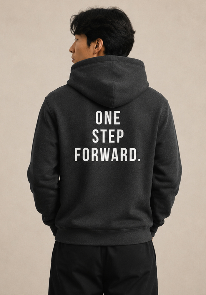 Back view of the black BROKEBOYLIFE hoodie featuring the bold "One Step Forward." motivational graphic.