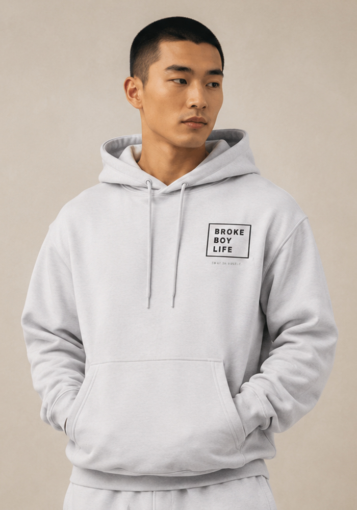 Model wearing the light gray BROKEBOYLIFE hoodie featuring the square logo on the left chest.